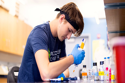 Undergraduate research assistant Cameron working in the lab